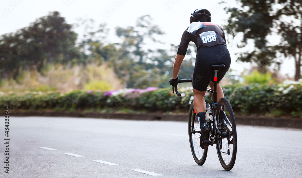 Professional cyclist during the cycling race. Shot in back - Image