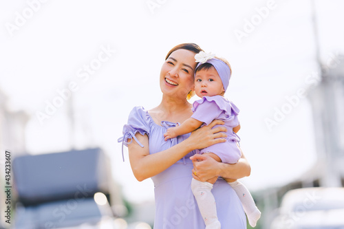 portrait of mom and baby with sunlight evening time a outdoor in happy emotional