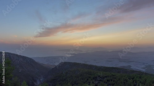 Beautiful day to night sunset time lapse over Athens Greece seen from the top of Ymittos photo