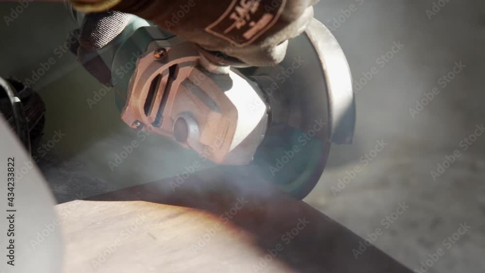Circular saw cuts wooden board. Slow-motion Circular saw cuts wooden board. Slow-motion