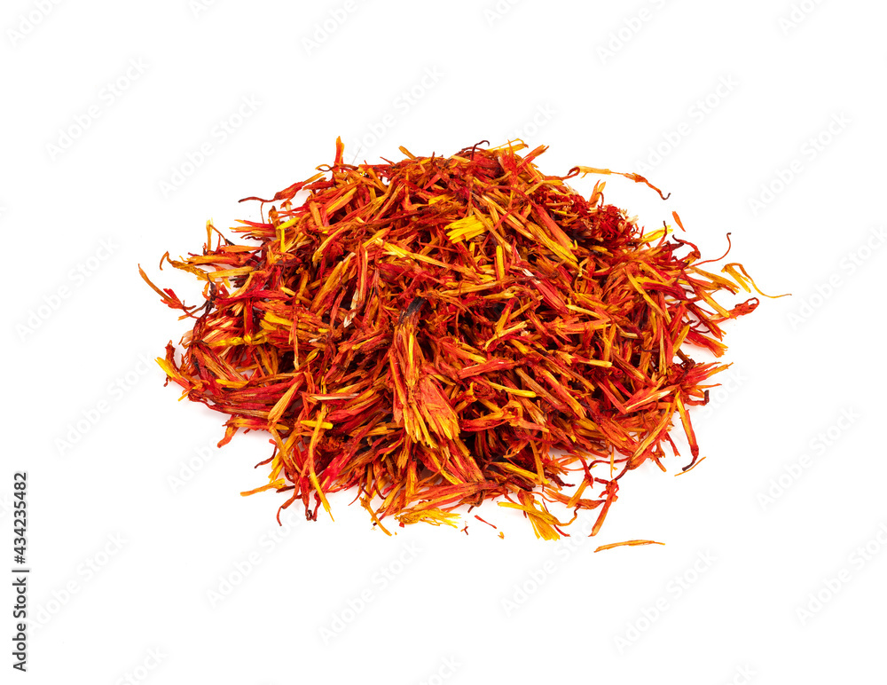 Fototapeta premium pile of dried safflower petals closeup on white