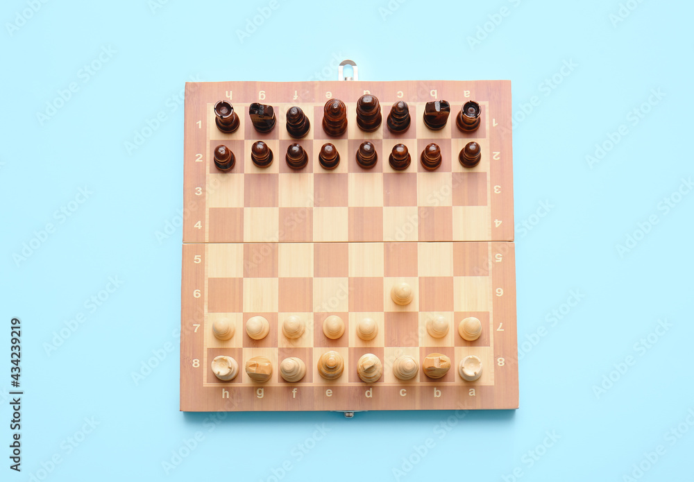 Game board with chess pieces on color background Game board with chess pieces on color background