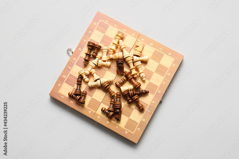 Game board with chess pieces on light background Game board with chess pieces on light background