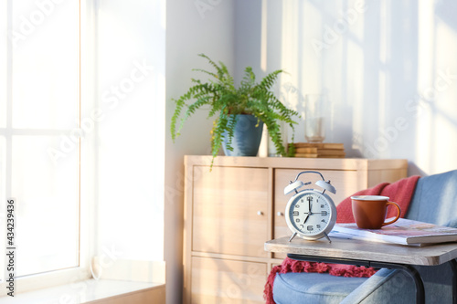 Alarm clock on table in int...