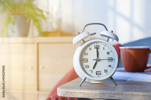 Alarm clock on table in room