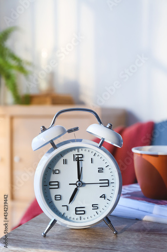 Alarm clock on table in room