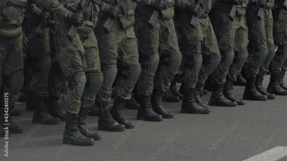A special forces unit marching through the square. Only the legs are visible in the frame. A special forces unit marching through the square. Only the legs are visible in the frame.