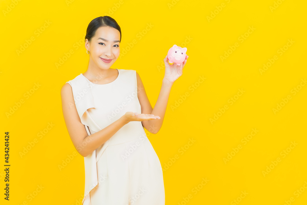 Portrait beautiful young asian woman with piggy bank Portrait beautiful young asian woman with piggy bank