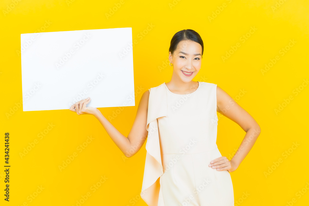 Portrait beautiful young asian woman with empty white billboard Portrait beautiful young asian woman with empty white billboard