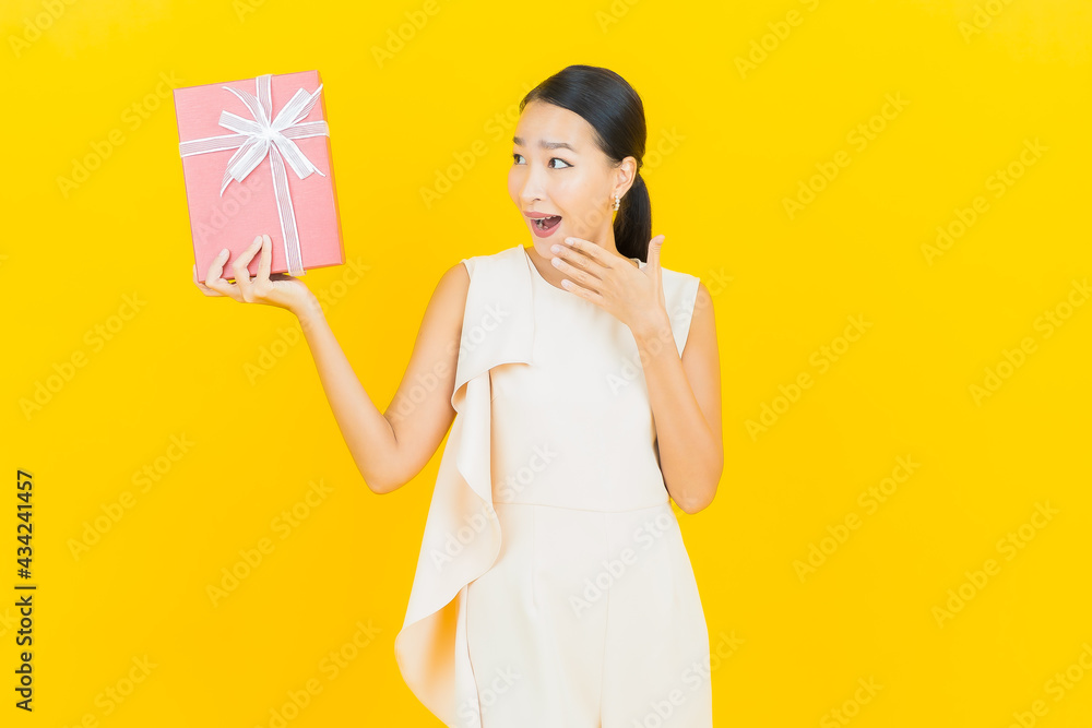 Portrait beautiful young asian woman smile with red gift box Portrait beautiful young asian woman smile with red gift box