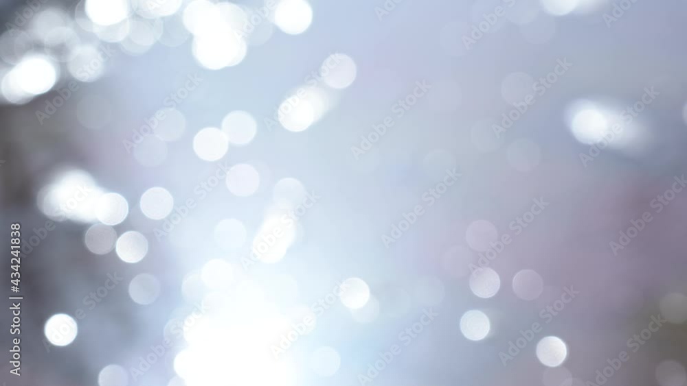 Abstract background with sun lights bokeh. 4k stock video footage of blurry defocused water and sunlight sparkling on surface Abstract background with sun lights bokeh. 4k stock video footage of blurry defocused water and sunlight sparkling on surface