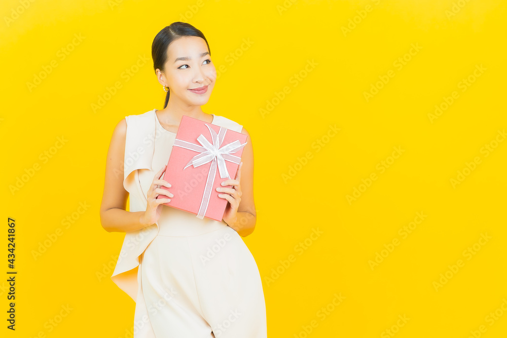 Portrait beautiful young asian woman smile with red gift box Portrait beautiful young asian woman smile with red gift box