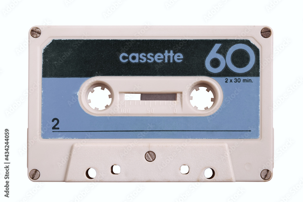 Obraz premium Vintage retro cassette tape on blue background, gadgets for The 70-80-90's