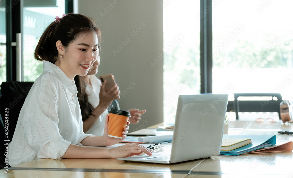 Portrait Of Attractive Asian Businesswoman Working On Laptop for business strategy planning. Portrait Of Attractive Asian Businesswoman Working On Laptop for business strategy planning.
