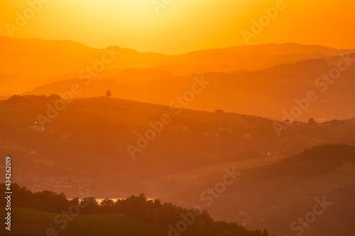 A warm summer sunset in the Ro  nowskie Foothills  near Nowy S  cz. Poland  Lesser Poland Voivodeship.