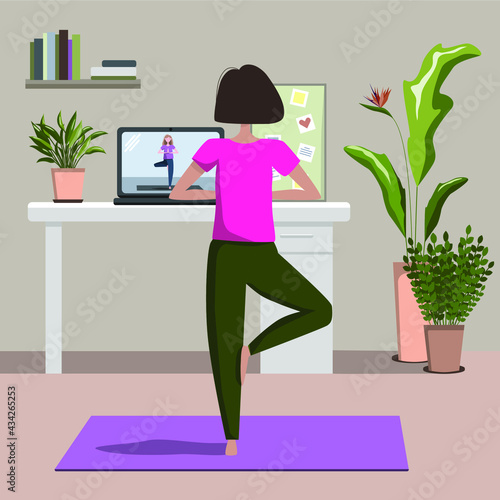 Yoga online concept with young woman doing yoga exercise at home with online classes on laptop with instructor. Live stream, internet education. Cozy modern interior. Home office