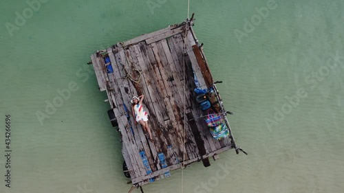 Woman lying on a raft at Koh Wai, Trat, Thailand.