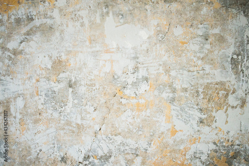 Scratched, cracked, flooded and bruised wall in an old industrial room (basement or warehouse). Industrial, texture or wallpaper background with brick and stains © Patrycja