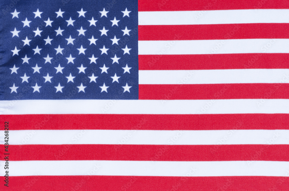Naklejka premium fabric of the US national flag close-up