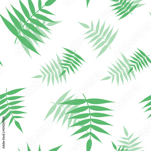 Seamless pattern from green branches. Background from tropical jungle leaves with transparency and overlay. Stylish summer texture. Spring print from tropics. Floral fabric, plant textile, green leaf.