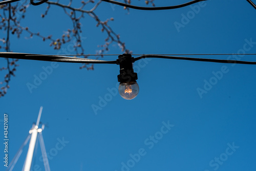 electric lamp on blue sky background