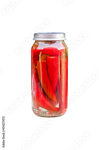 Chili peppers in a glass jar, homemade pickles