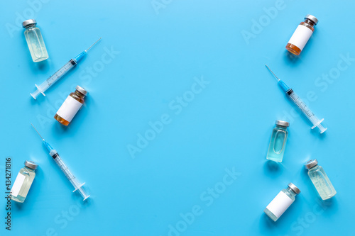 Inject the vaccine. Coronavirus vaccine ampoules with syringe