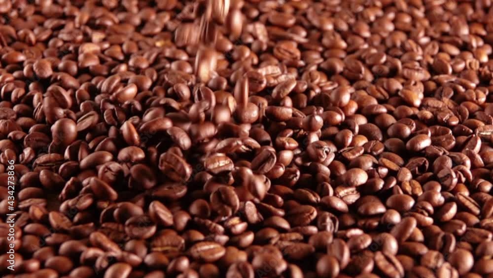 Beans of Coffee Fall on a Heap. Slow Motion Beans of Coffee Fall on a Heap. Slow Motion
