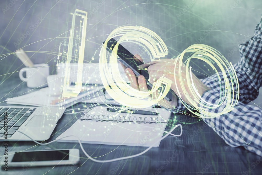 Double exposure of man's hands holding and using a phone and crypto currency blockchain theme drawing. Double exposure of man's hands holding and using a phone and crypto currency blockchain theme drawing.