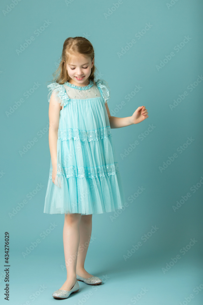 Elegant girl in a dress. Youth fashion concept, happy child. Elegant girl in a dress. Youth fashion concept, happy child.