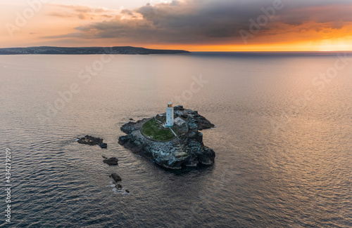 Aerial view of Godrevy Lighthouse at sunset, Gwithian, Cornwall, United Kingdom. photo