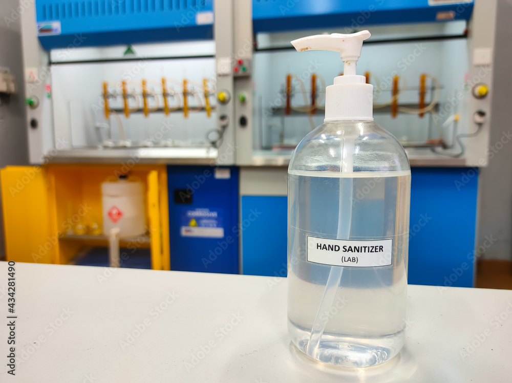 Malaysia, Perak, 30 April 2021: A bottle of hand sanitizer placed on a table in a laboratory. Malaysia, Perak, 30 April 2021: A bottle of hand sanitizer placed on a table in a laboratory.