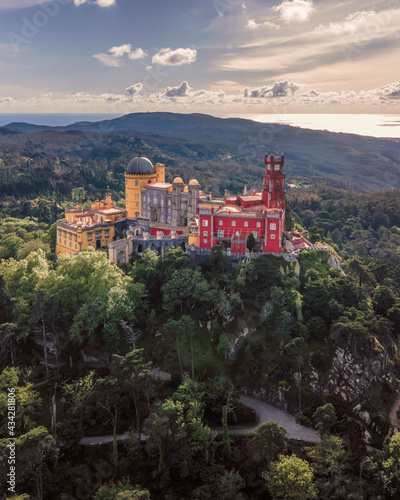 Aerial view of Pena Palace, a hilltop Romanticist palace in parkland at sunset, Sintra, Lisbon, Portugal.