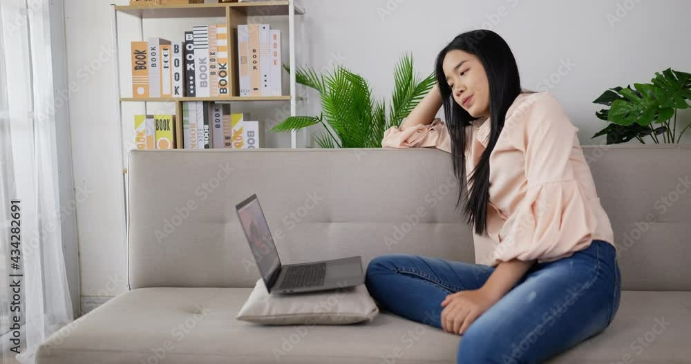 Woman watching and sitting on couch Woman watching and sitting on couch