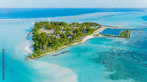 Panoramic aerial view of the local island Mathiveri with harbour, Alif Alif Atoll, Maldives. photo