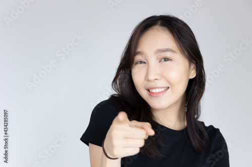Wallpaper Mural happy smiling woman pointing at you Torontodigital.ca