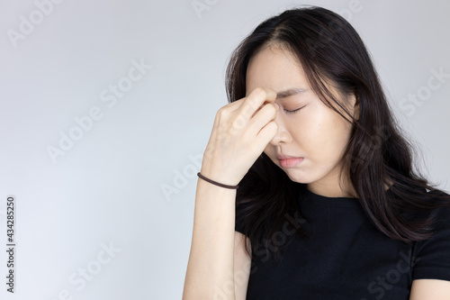 unhappy woman having headache with stress or migraine
