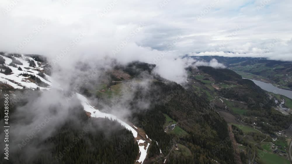 clouds over mountain landscape foggy cloudy clouds norway
