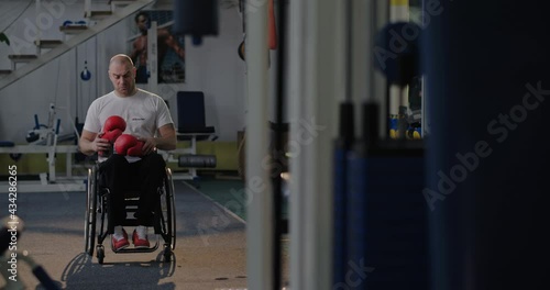 Wallpaper Mural Handicapped boxer examining gloves before training Torontodigital.ca
