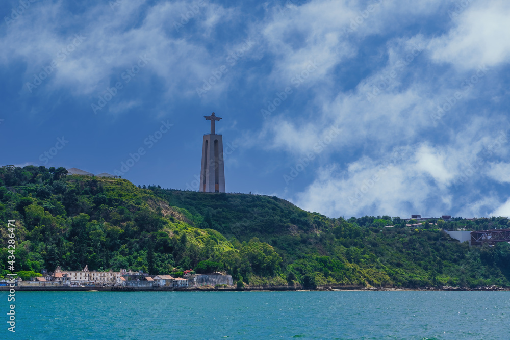 Sanctuary of Christ the King monument over the Tagus River in Almada, Portugal