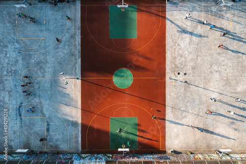Aerial view of people playing basketball in public street courts in Kaunas city, Lithuania. photo