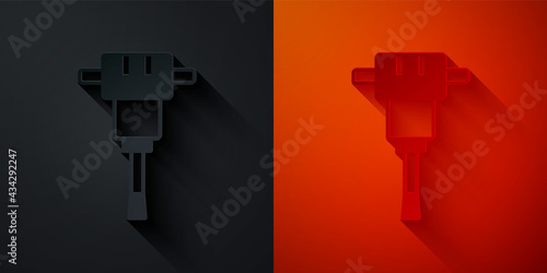 Paper cut Construction jackhammer icon isolated on black and red background. Paper art style. Vector