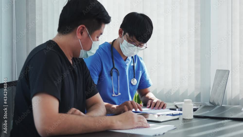 Asian doctor talking the patient at clinic with patient condition and the treatment result. Asian doctor talking the patient at clinic with patient condition and the treatment result.