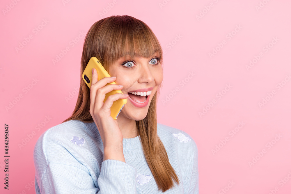 Portrait of attractive girlish cheerful girl calling friend discussing news having fun isolated over pink pastel color background Portrait of attractive girlish cheerful girl calling friend discussing news having fun isolated over pink pastel color background