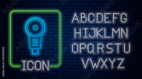 Glowing neon Angle grinder icon isolated on brick wall background. Neon light alphabet. Vector