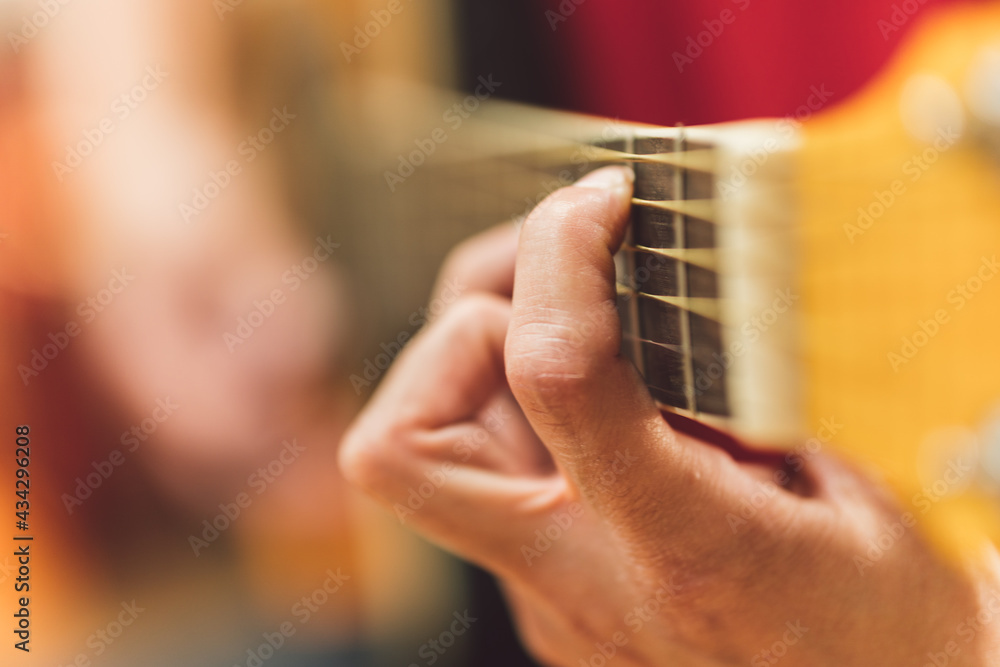 Fototapeta premium Person playing a classical guitar