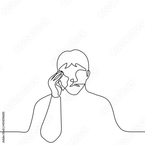 man crying and wiping his tears with a handkerchief - one line drawing vector. concept of sobbing alone, mourning grief