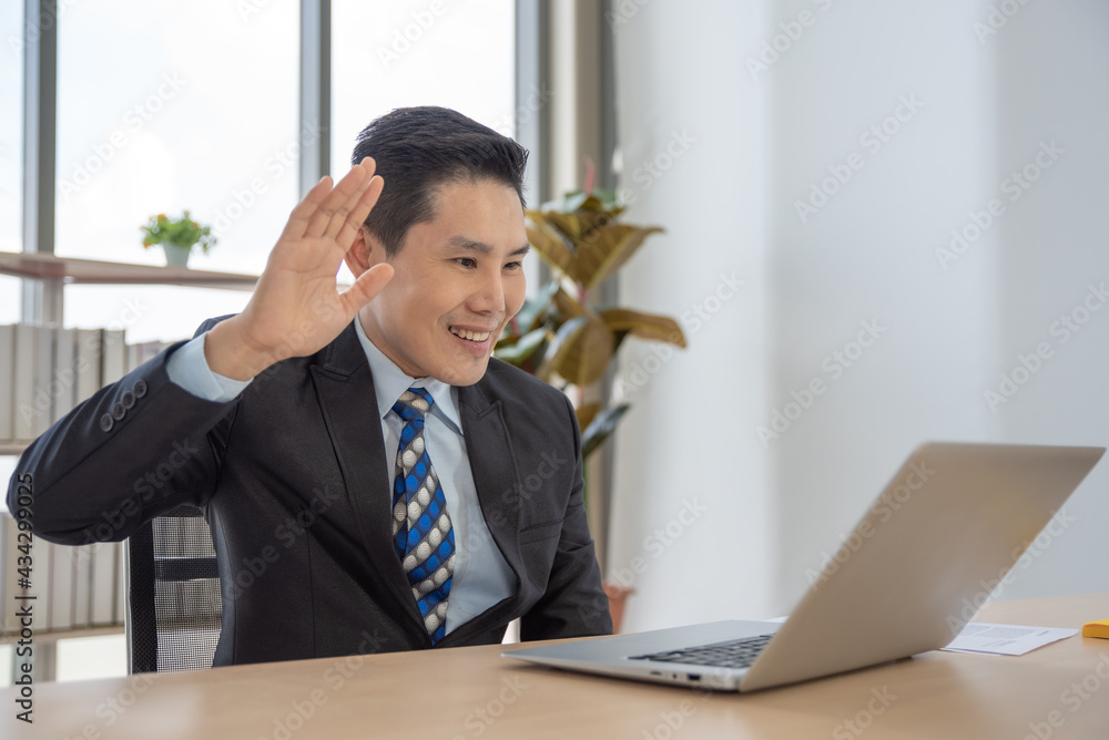 Businessman having video call via laptop in the office Businessman having video call via laptop in the office