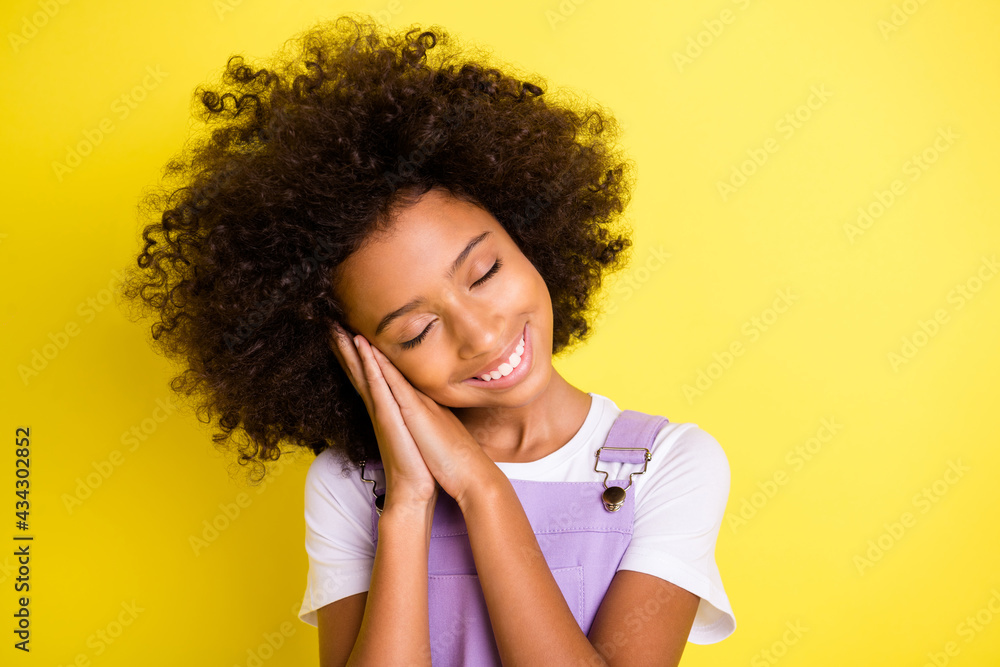 Portrait of pretty dreamy cheerful wavy-haired girl enjoying sleeping calm isolated over bright yellow color background - obrazy, fototapety, plakaty 