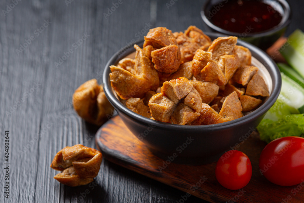 Beef ball fried on the dark wooden background. Beef ball fried on the dark wooden background.